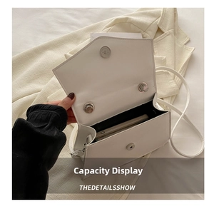 Interior view showing the capacity and smooth lining of the white bow crossbody bag