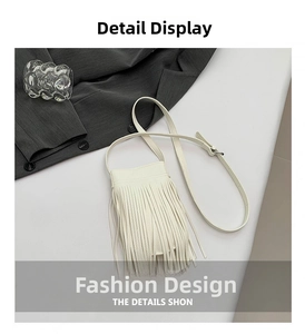 Detailed view of a white PU leather phone bag with long tassels and adjustable strap