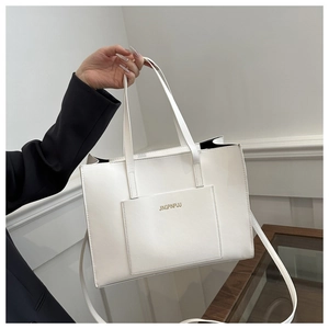 Close-up of white tote bag with adjustable strap and embossed JINGPINPIJU lettering
