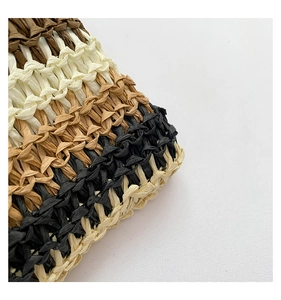 Macro shot of striped woven straw tote bag texture with natural fiber detailing