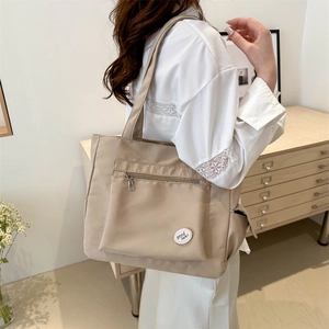 Minimalist khaki large capacity tote bag for women with front zipper and Good Luck logo