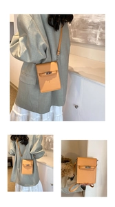 Detail of bright orange cross-pattern leather mini square bag with silver turn-lock clasp