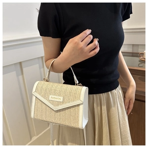 Contrast straw woven crossbody bag with white leather trim and gold fashion logo