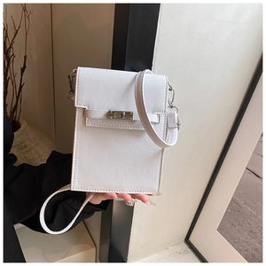 Detailed close-up of a white textured crossbody phone bag with silver twist lock and strap