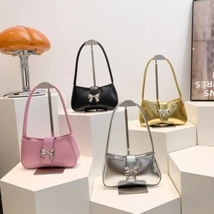 Elegante Schultertaschen 2024 mit Schleifendekor in Pink, Schwarz, Gold und Silber