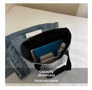 Quilted tote bag interior showing large capacity for tablet, umbrella, and wallet