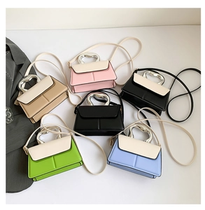 Collection of textured crossbody bags with unique silver metal handles in various colors