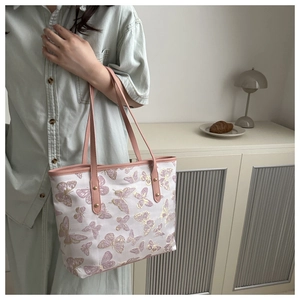 Elegant floral embroidery tote bag with butterfly patterns and pink leather handles