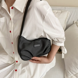 Minimalist black nylon hobo bag with pleated design and silver zipper for women
