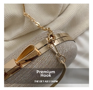 Detail of high-quality gold metal hook and glitter texture on elegant evening clutch bag