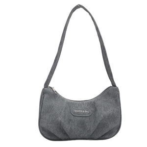 Deep grey pleated crescent shoulder bag in soft suede fabric with a minimalist design