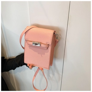 Pink cross-grain leather mini crossbody bag with a classic metal twist lock closure