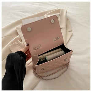 Pink quilted chain bag interior capacity showing phone and card holder storage
