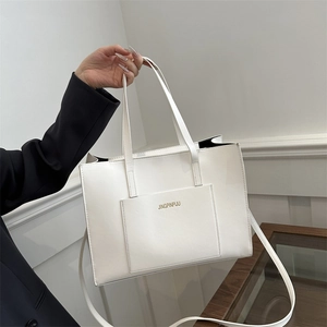 White minimalist square tote bag with fine texture, dual handles and adjustable shoulder strap