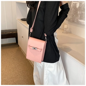 Detailed side view of pink mini crossbody phone bag with adjustable leather strap