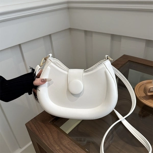 Elegant white crescent moon shoulder bag with round button flap and gold hardware