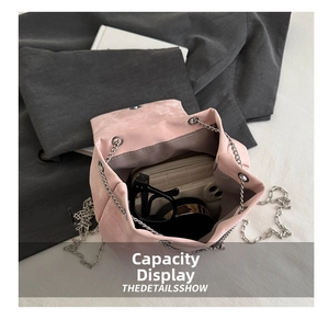 Detailed interior view of a pink bucket bag showing storage space for daily essentials