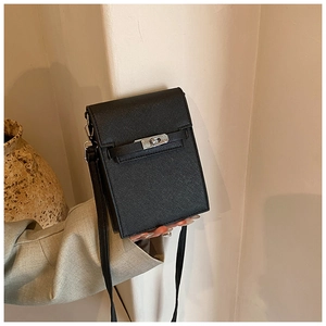 Detail of black Saffiano leather mini crossbody bag with a silver twist lock closure