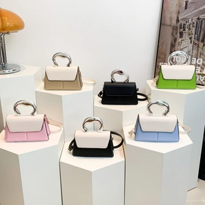 Minimalist leather crossbody bags with metal handles in various stylish colors