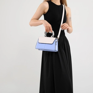Modern color-block square bag in light blue and cream leather with silver metal handle