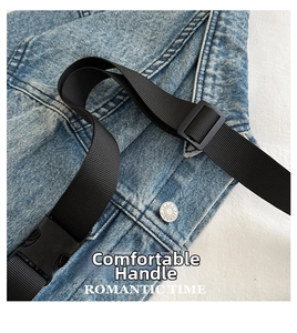 Detail of blue denim fabric with black nylon strap and adjustable plastic buckle