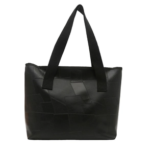 Fashionable black patchwork tote bag with stitched texture and wide fabric strap for daily use