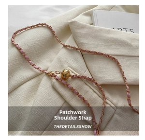Detail of pink leather chain strap with quilted gold sphere adjustment ball