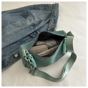 Detail of mint green canvas bag interior showing large capacity for daily essentials