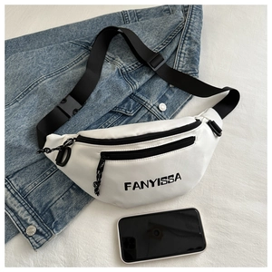 Detailed macro view of white synthetic leather crossbody bag with FANYISSA black logo print