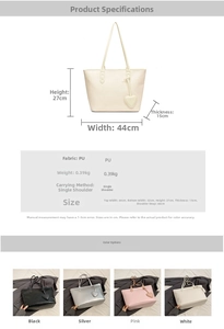 Detail view of large PU tote bag showing dimensions and the decorative heart pendant
