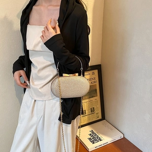 Elegant champagne gold sequin evening clutch bag with bow clasp and metal chain
