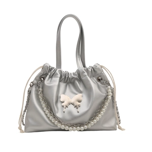 Silver pleated bucket bag with pearl chain and butterfly metal buckle on white background