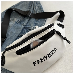 Close-up of white FANYISSA sling bag with dual zippers and adjustable black strap