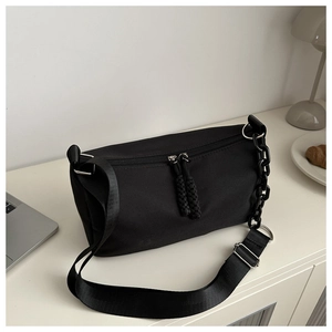 Detail view of the durable black nylon pillow bag with double zippers and chunky chain