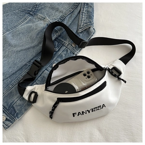 Interior view of white Oxford crossbody bag showing capacity for phone and cosmetics
