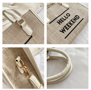 Detailed view of woven canvas tote stitching with gold-tone hardware and leather handle