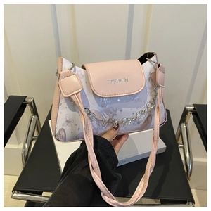 Detail of pink and white crossbody bag with lavender butterfly prints and metal flower chain