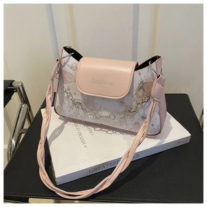 Detail of pink and white floral crossbody bag with gold chain and FASHION logo