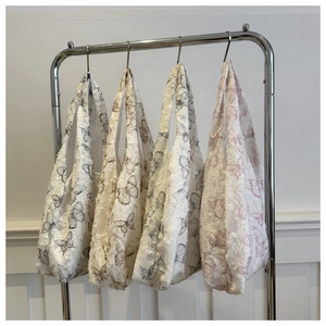Chiffon tote bags with 3D butterfly embroidery in four colors on a metal hanger