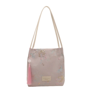 Sac fourre-tout élégant brodé de fleurs mauves avec glands pour la mode estivale chic