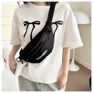 Close-up of black nylon crossbody fanny pack featuring white FANYISSA logo and dual zippers