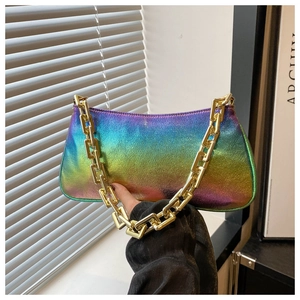 Macro detail of iridescent gradient shoulder bag with chunky gold chain strap