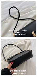 Detail of matte black leather shoulder bag showing the strap connection and sturdy base