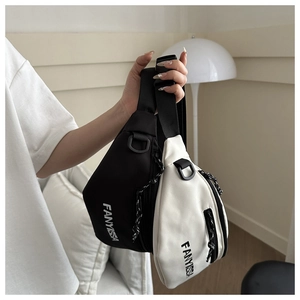Close-up of black and white dumpling bags featuring FANYISSA logo and adjustable straps