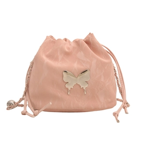 Pink drawstring bucket bag with silver butterfly charm and metal chain strap