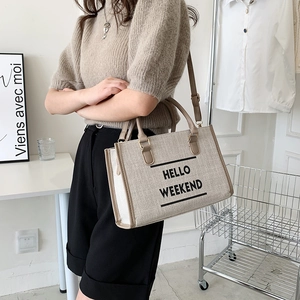 Retro canvas tote bag with brown trim and Hello Weekend print in beige finish