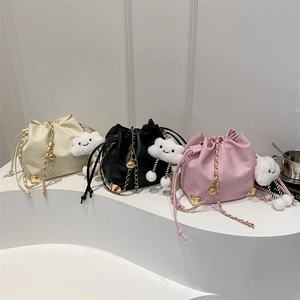 Three Korean-style bucket bags in cream, black, and pink with gold chain straps and cloud charms