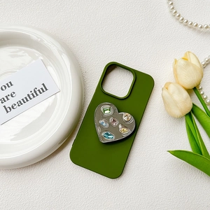Dark green iPhone case with heart-shaped mirror grip featuring colorful gemstones