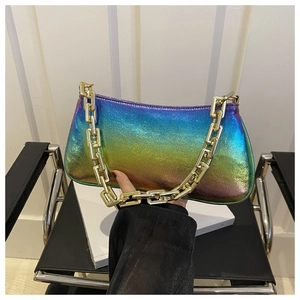 Close-up of iridescent gradient underarm bag with a bold gold chain and metallic texture