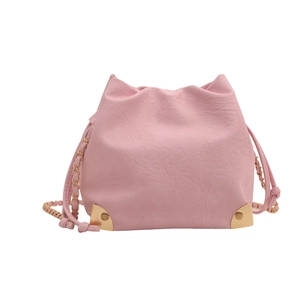 Pink drawstring bucket bag with gold metal corners and chain strap for women